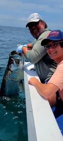 Big tarpon cruising the beach!