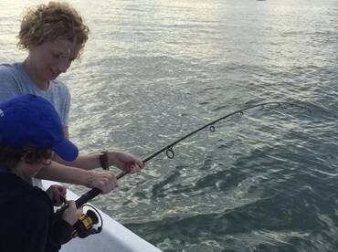 Jenn and her 11 year old son working as a team @ San Juan Bay Puerto Rico Fishing.