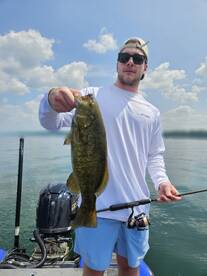 Client O with a big Erie smallmouth bass