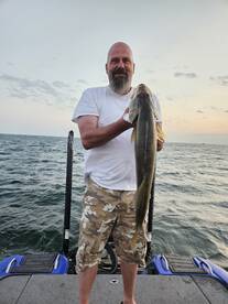 Client Cliff with a giant Erie Walleye