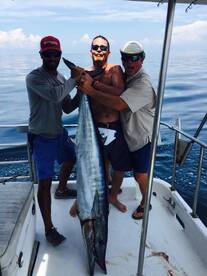 Shawn, Matt and Capt Cuz enjoying the catch!