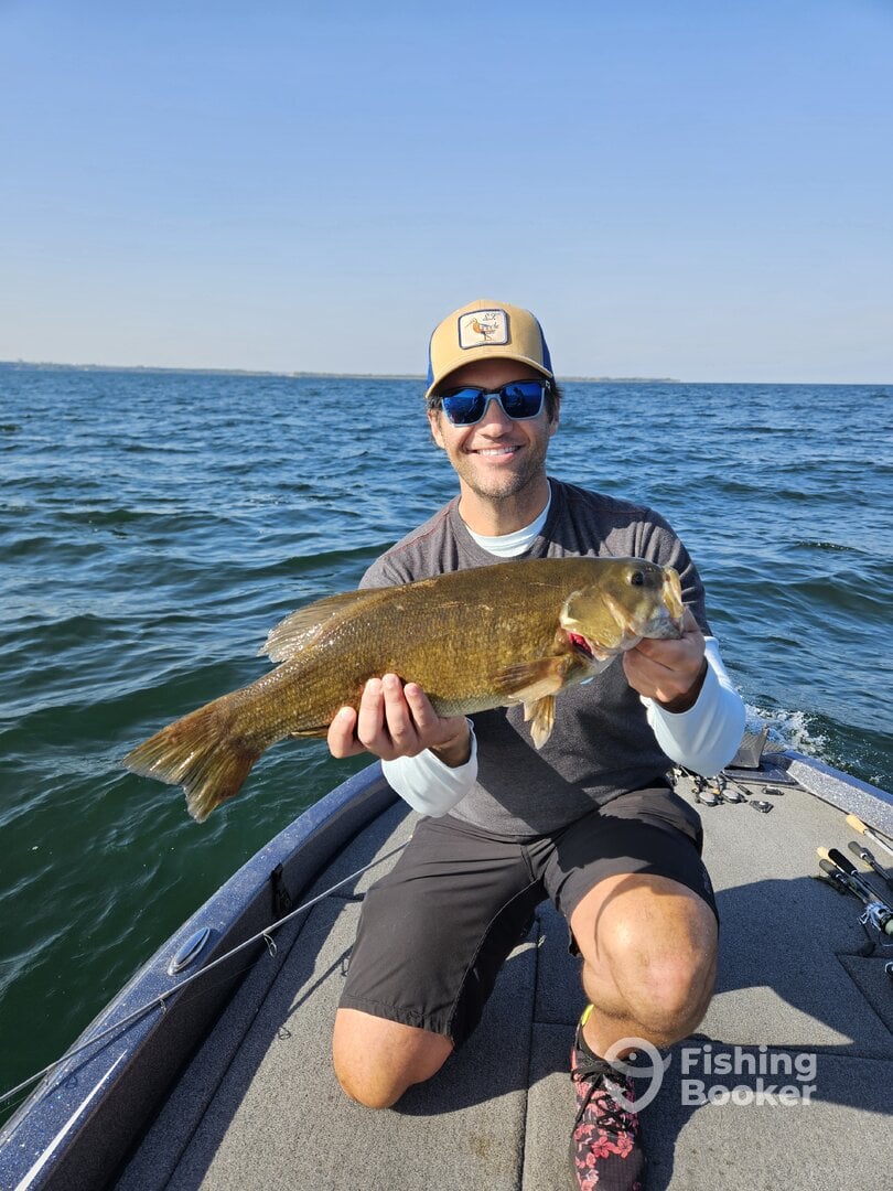 Client of Big Fat Bass Guide Service with a bass