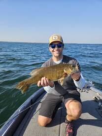 Client of Big Fat Bass Guide Service with a bass