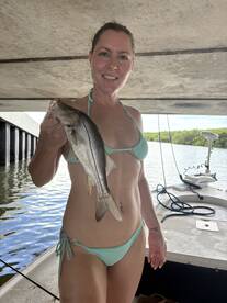 SHE CAN CATCH EM, TOO DESPITE THE RAIN.