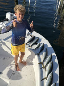 	“Young Angler, Big Catch!”