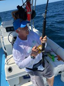 Ken reeling in the second fish