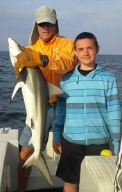This young boy caught his first Shark great memory