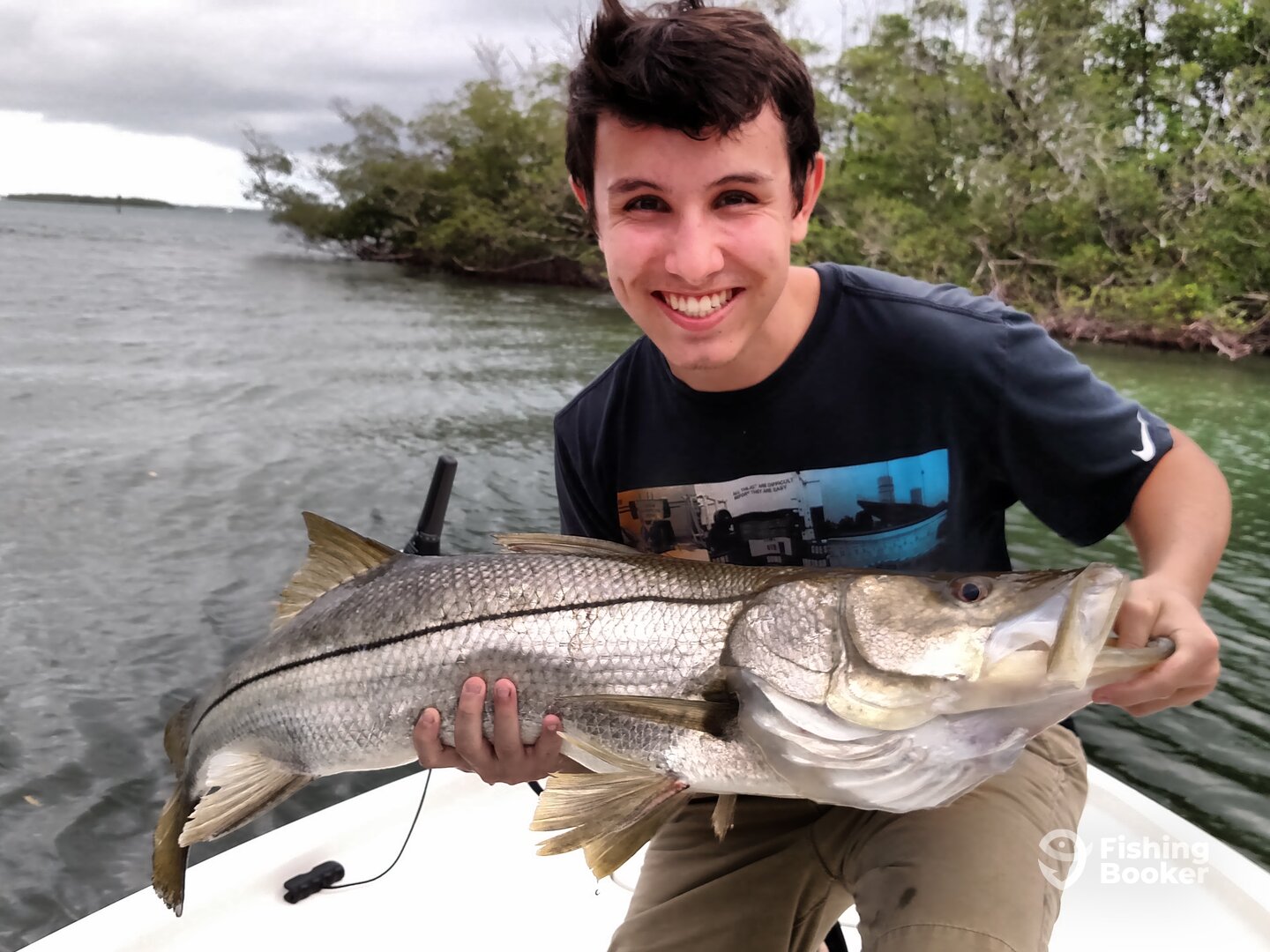 TJ did a great job of landing his first snook.