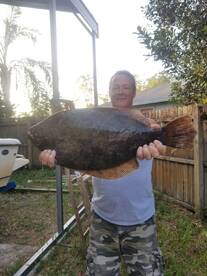 doormat size flounder and bull redfish