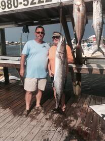 Happy angler with 57# King on the Jus Cuz!