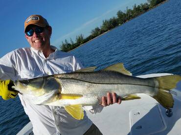 Happy client with fish of a lifetime. San Juan, Puerto Rico