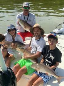 Family Fun catching Redfish in St.Peters