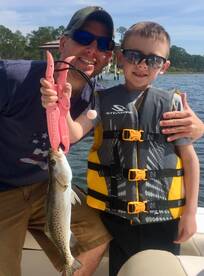 father son with trout
