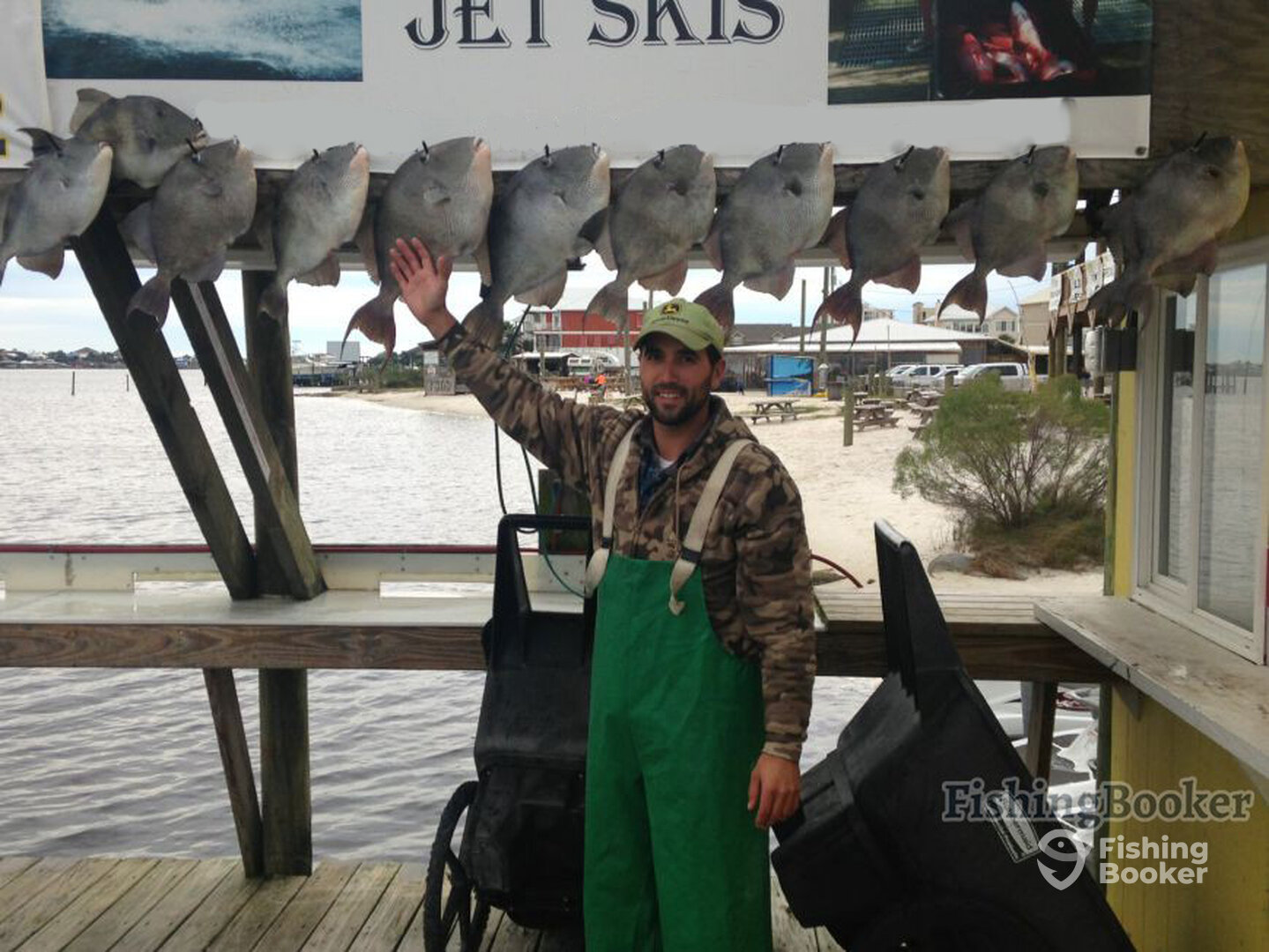 Sean showing off his catch
Of triggerfish on the Jus Cuz!