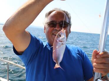 Aperitif on board and bottom fishing