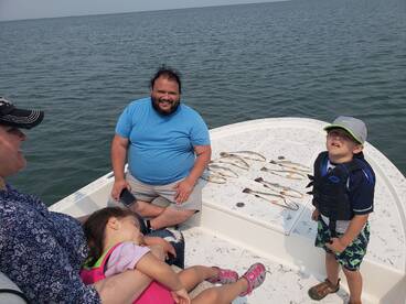 Speckled trout with my little customer. 