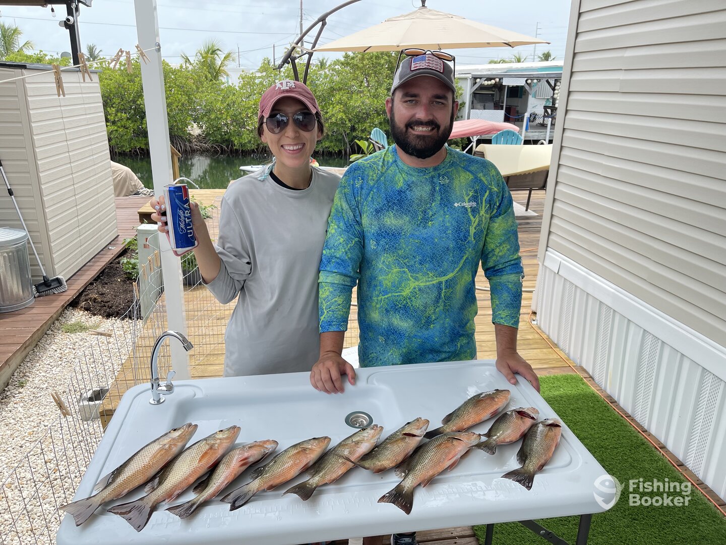 Caitlyn and Adrian with a limit of mangroves snap
