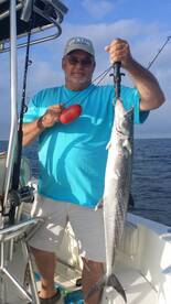 Dale with his first Kingfish and first fish of the day. Within 5 minutes of putting lines in the water!
