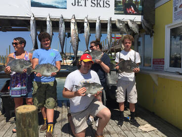 Our crew with the fruits of their trip!