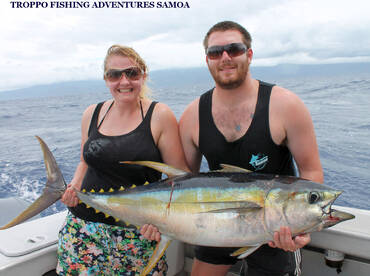 Rob was real proud of Michele after she landed her first Yellowfin Tuna