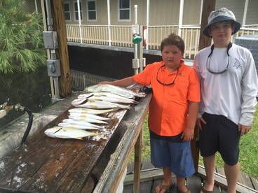 This is my son and one of our buddy's son from Sunday with some nice trout and one big tripletail