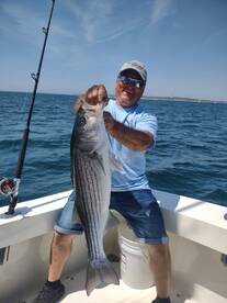 HENRYS FIRST STRIPED BASS