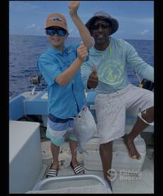Happy little guy with his first catch.