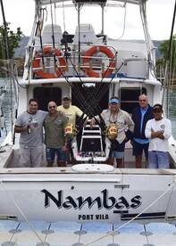 Happy anglers enjoying a cold beer on Nambas