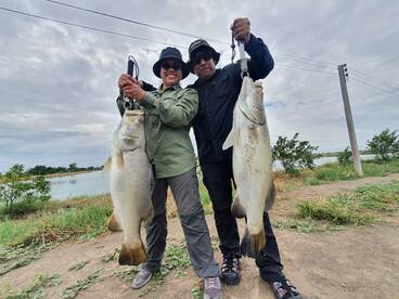 Singapore Couple Fishing Barramundi in T
