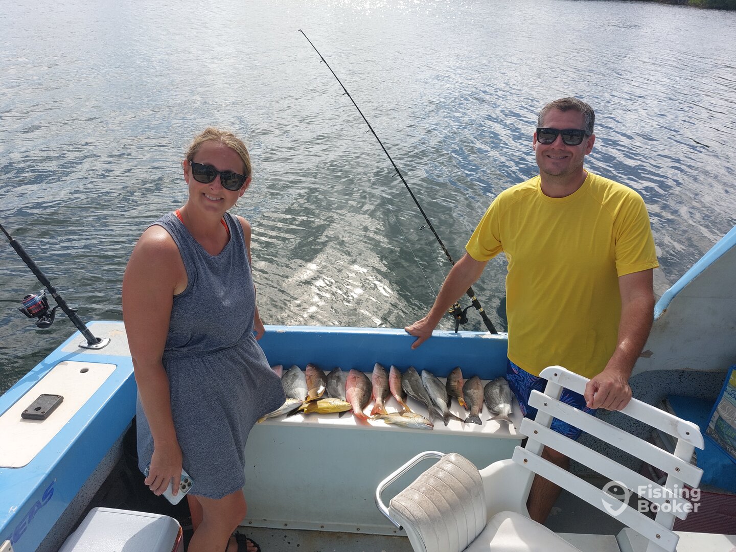 Lovely couple with their lovely catch. 