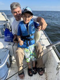 The youngsters putting on a fish catchin