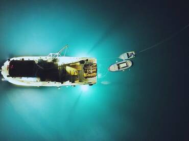 Night tuna fishing near fishing boat