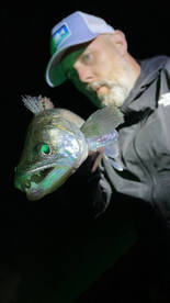 Oli and his Zander. Our favourite shot s