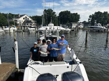 Happy Family catch a mix of Stripers, Wh