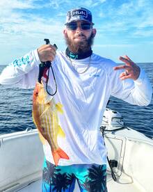 Filling the cooler with lane snapper