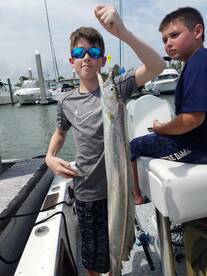 Trevor with his favorite fish photo.