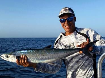 Hot kingfish bite. Reef fishing in San Juan