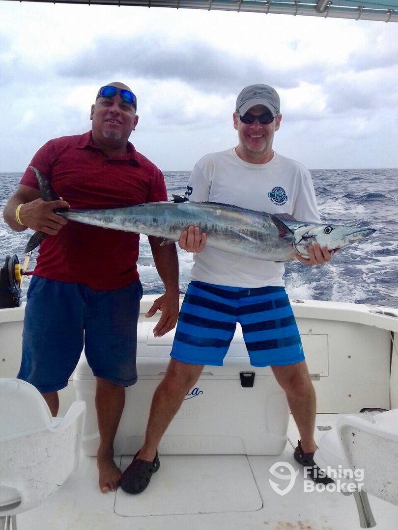 Juan Ramon and mate Edward Maduro with a Wahoo 12 kilo