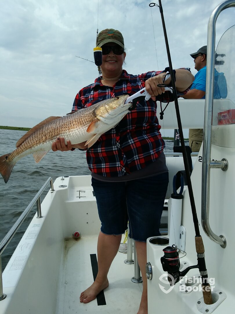 Ms. Dawn with the first Redfish of the day