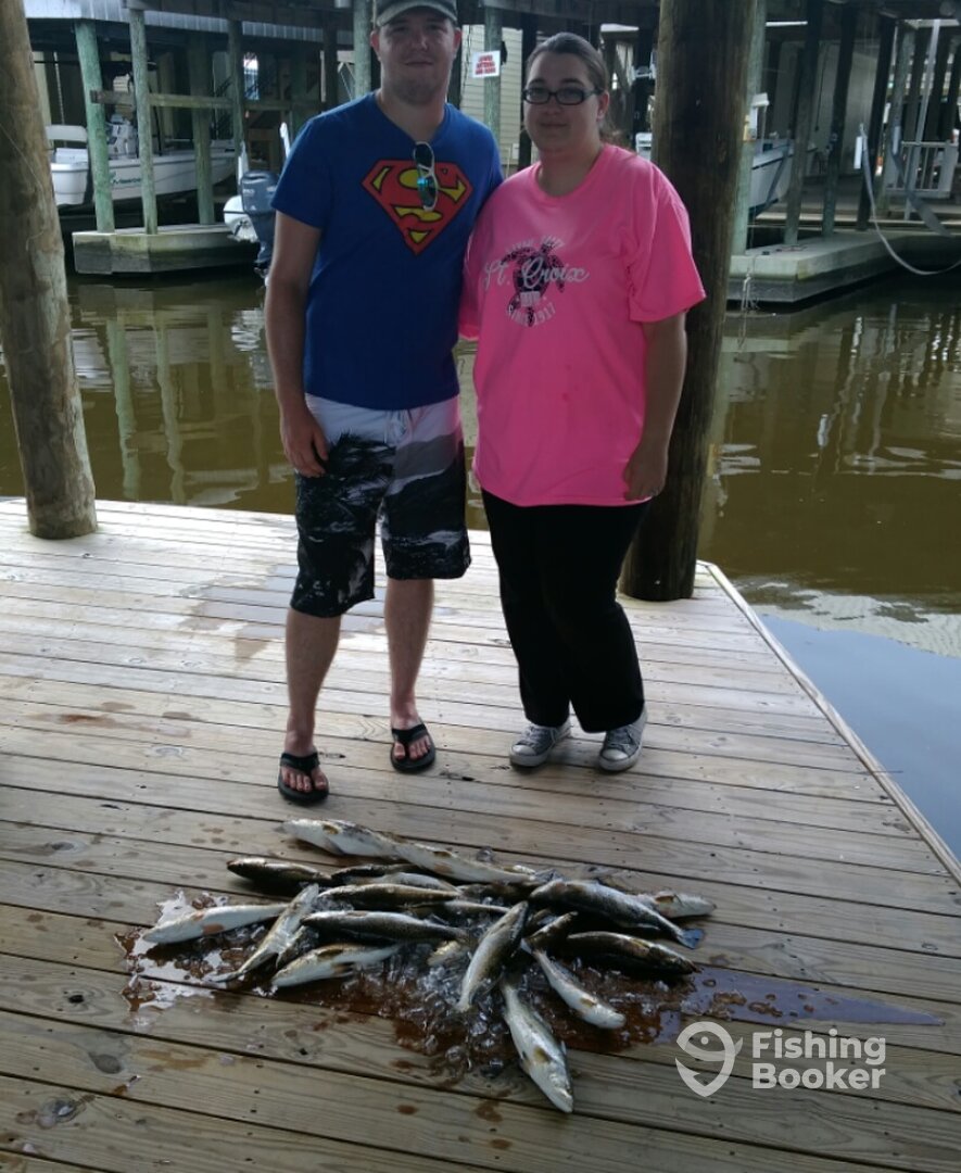 Mr. and Mrs. Pennington with their Trout