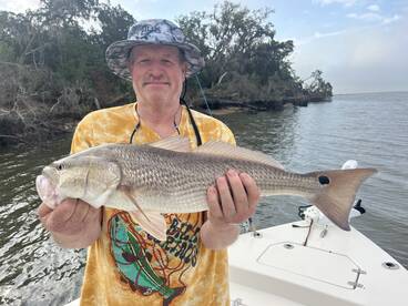 Travis with his first fish of the day. 