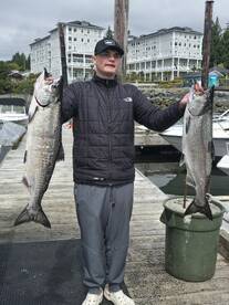 Father and son catch their first salmon 