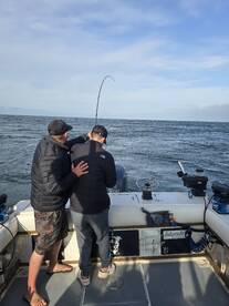 Father helping his son land guys first C